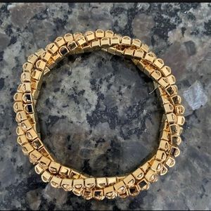 Sparkly gold bracelet.  No clasp.  Slides over wrist.  Great bridesmaid gift.